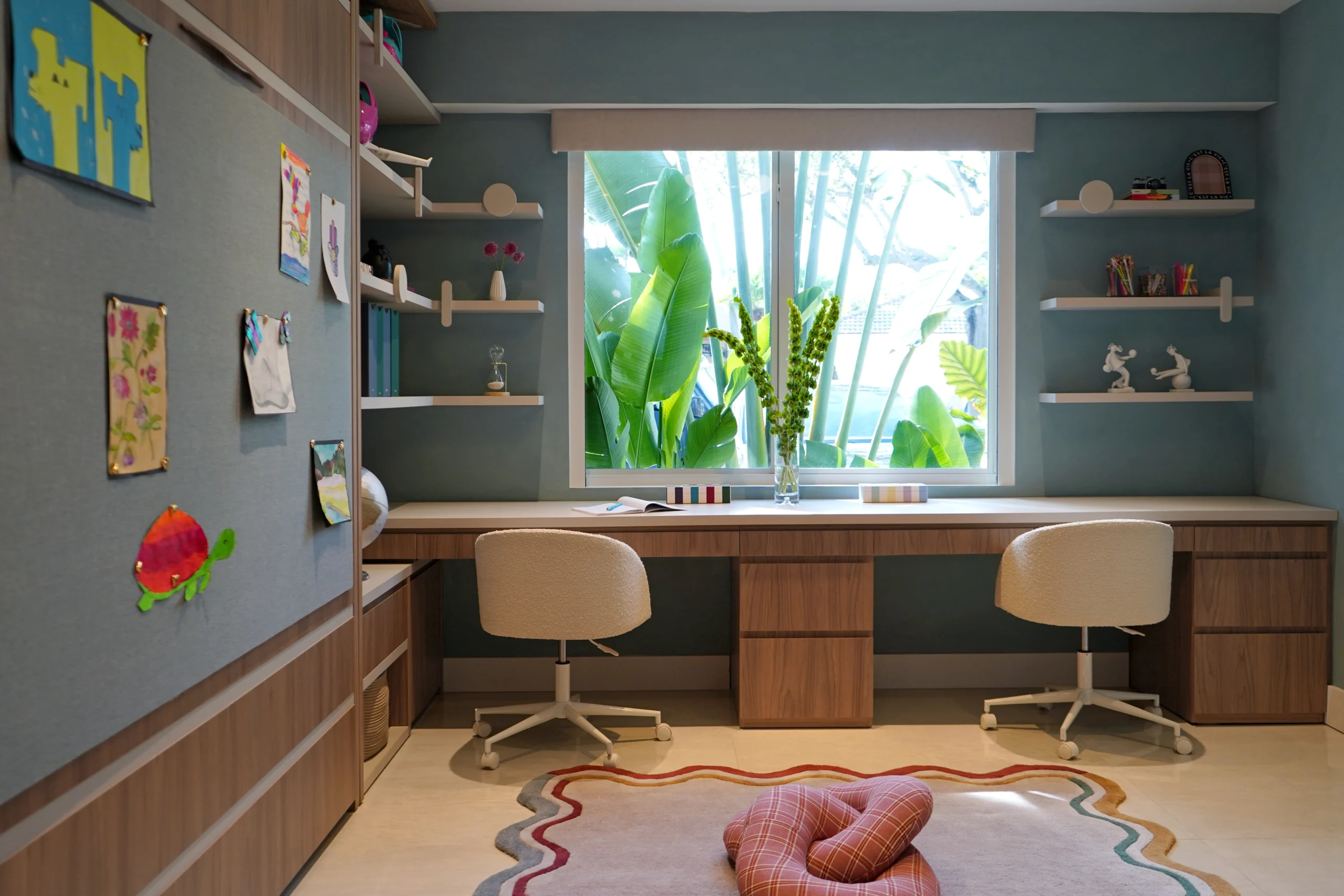 Custom kids playroom with double study desk, built-in storage and playful scalloped rug