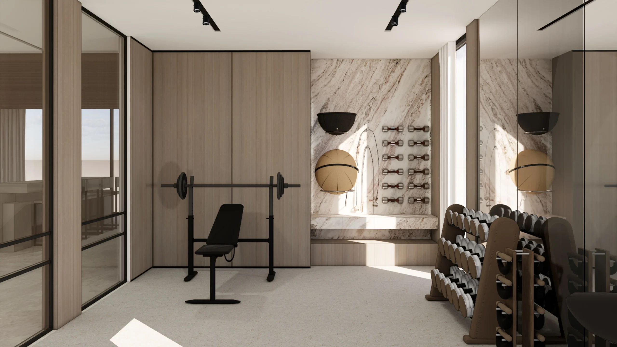 Private gym with free weights, bench station and marble accent wall in a luxury residence