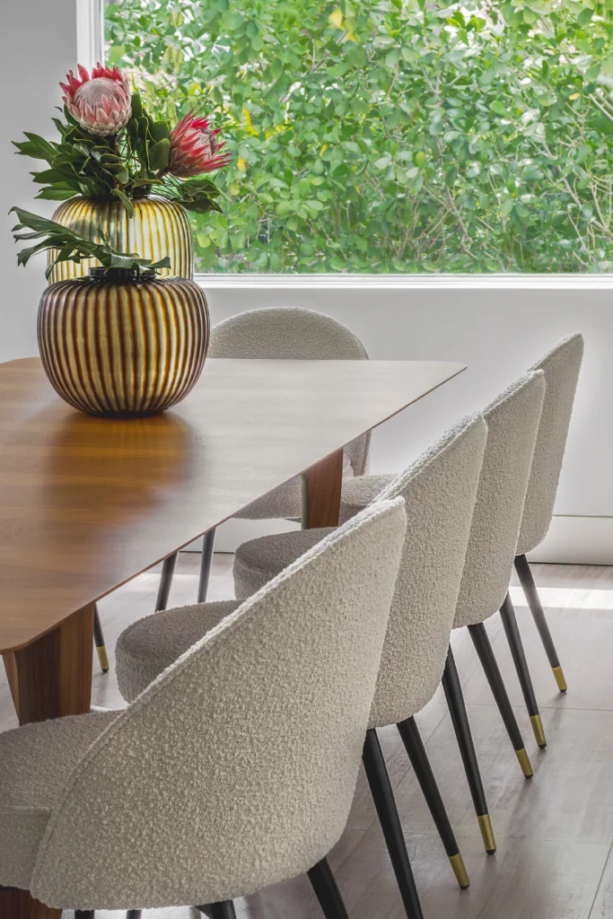 Custom oak millwork and integrated bar styling in a refined contemporary Miami interior