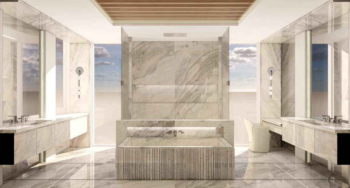Primary bathroom with freestanding tub, dual vanities and floor-to-ceiling marble surfaces