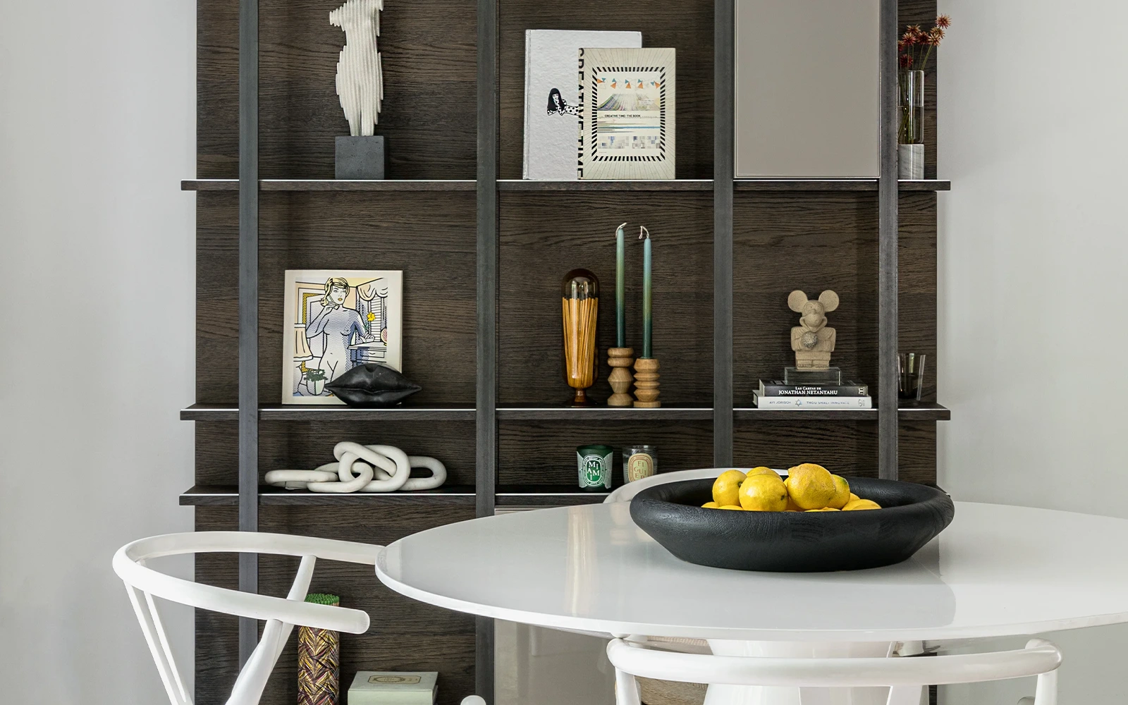 Miami Private Residence renovation with dark custom shelving and curated modern styling